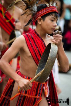 young performer with a gong